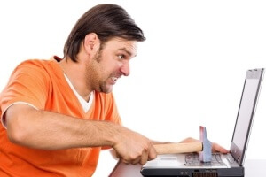 man hitting computer with a hammer - PC repair Macclesfield